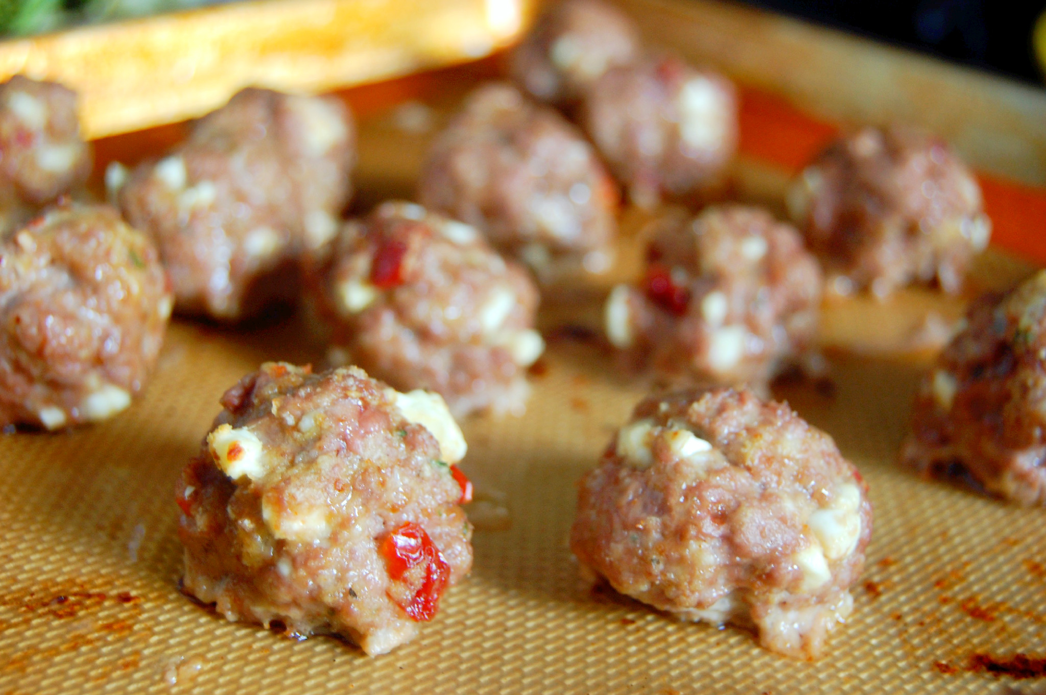 A simple lamb meatball recipe baked in the oven, studded with feta and sundried tomatoes | uprootkitchen.com