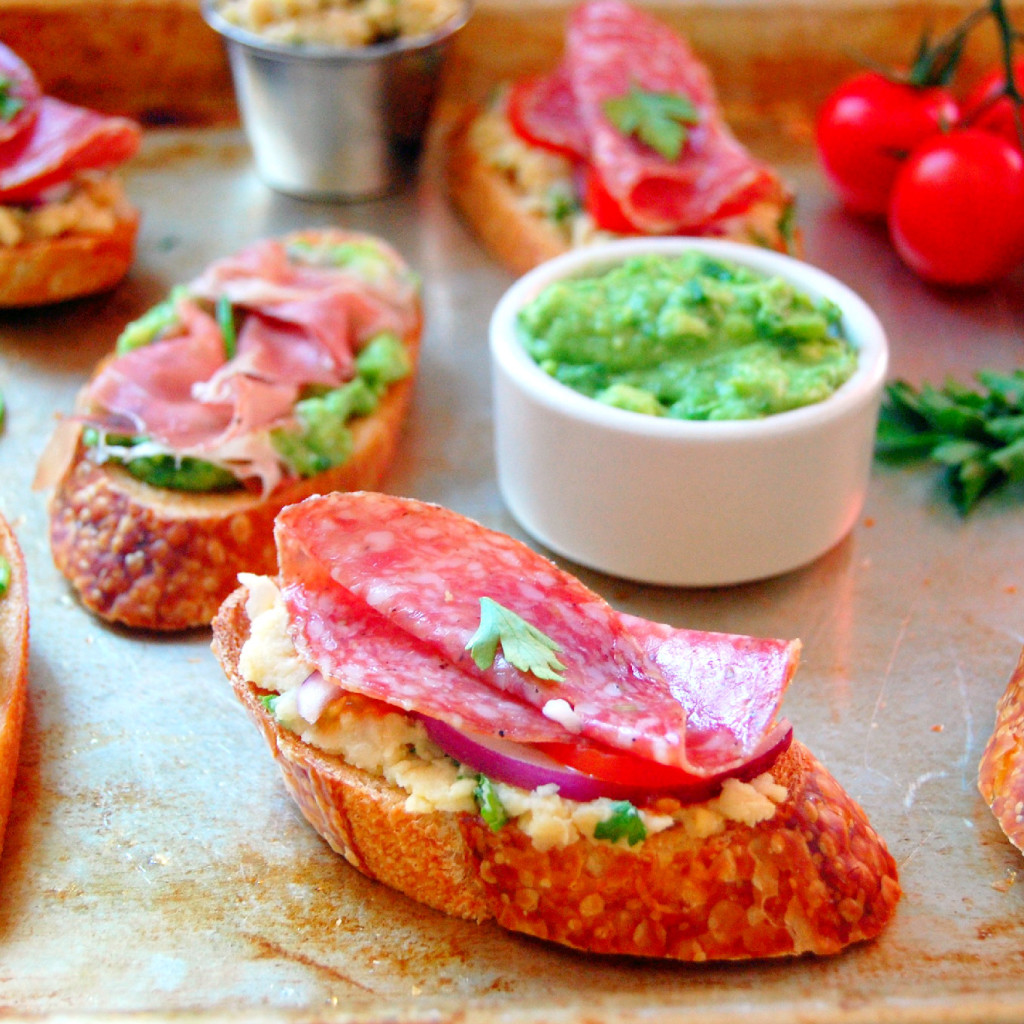 Simple appetizer ideas for summer parties - including an Avocado Prosciutto Crostini and a Smashed Chickpea Salami Crostini | uprootkitchen.com