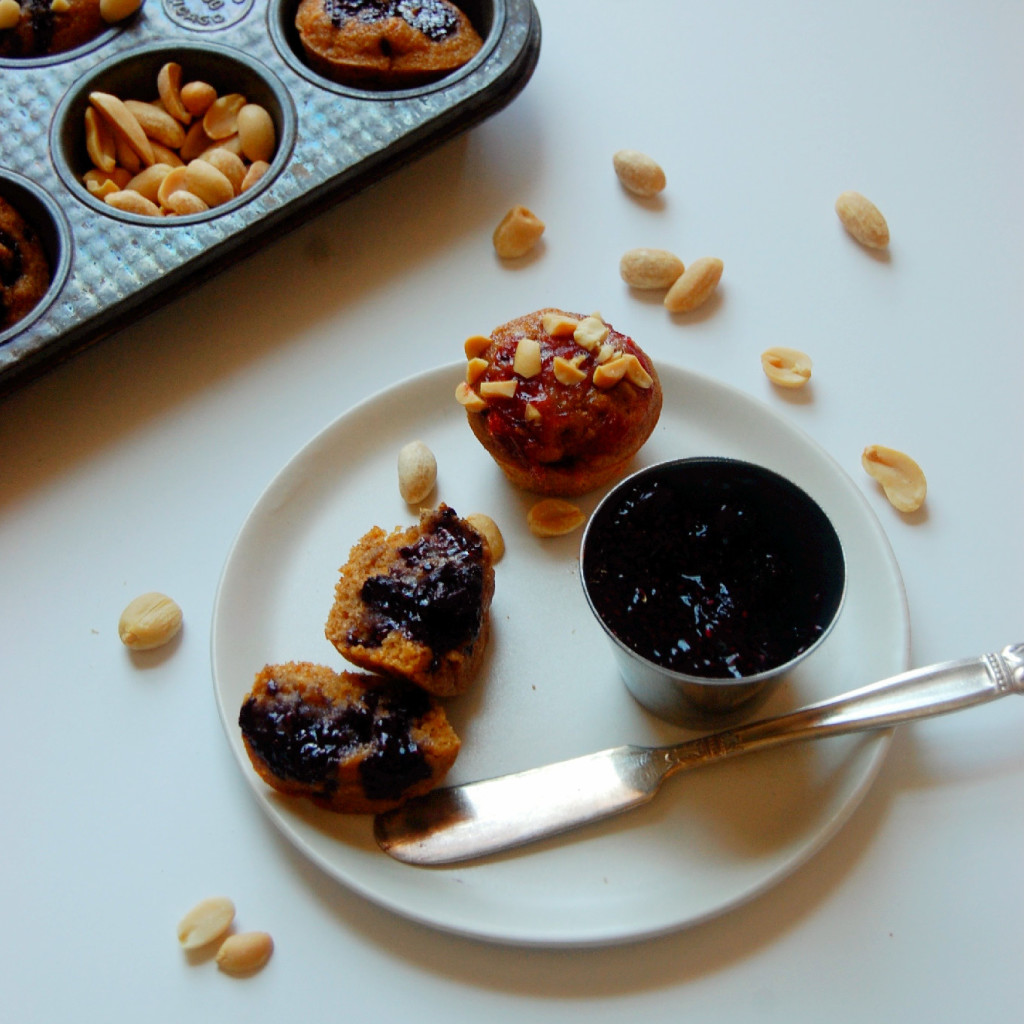 Mini Peanut Butter and Jelly Muffins - made with peanut flour, your favorite jam, and a crunch of peanuts on top! Perfect for lunchboxes or an on the go snack. | uprootkitchen.com