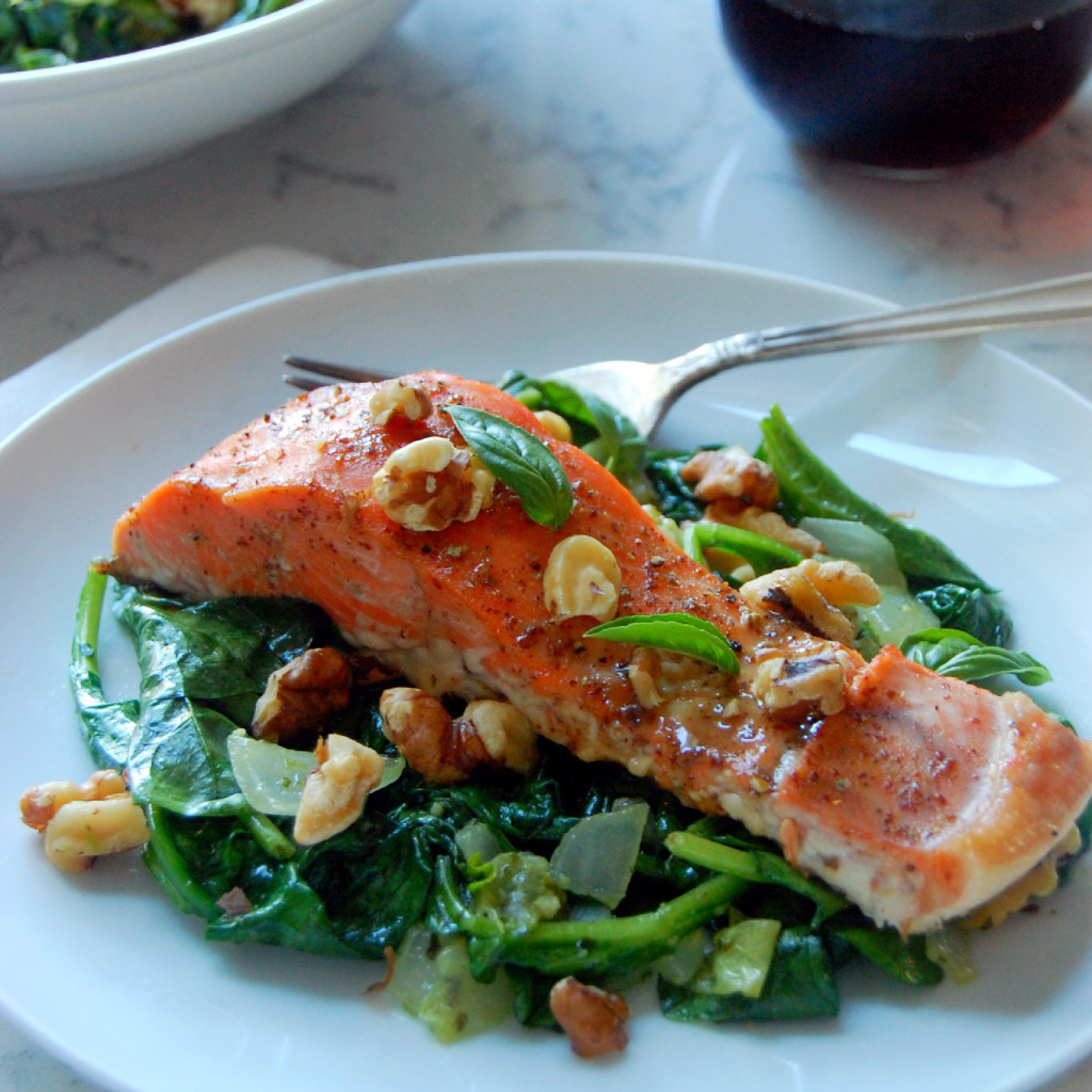 Salmon glazed with dijon and maple syrup, served on garlic and basil infused wilted spinach and toasted walnuts! The best part? 30 minutes start to finish for a beautiful dinner! | uprootfromoregon.com.jpg