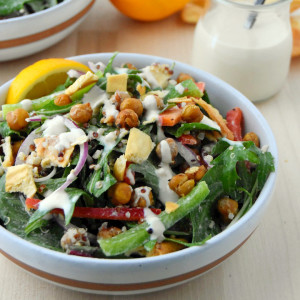 Mediterranean Salad with crispy garlic chickpeas, lemon hummus dressing, and pita chips. | uprootkitchen.com