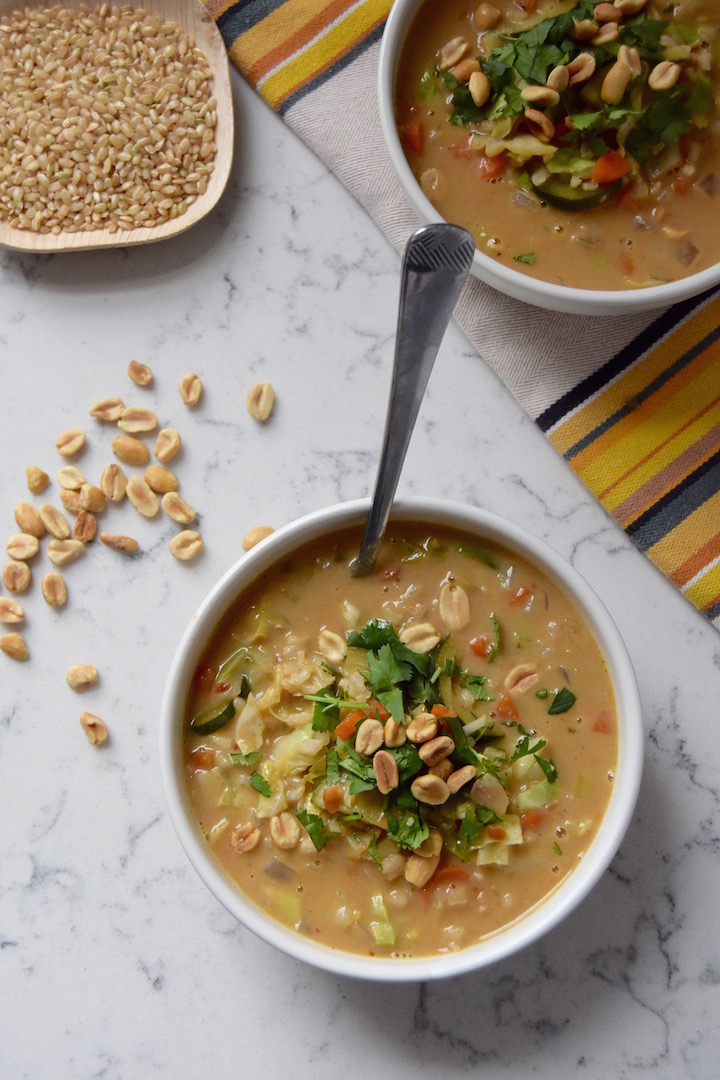 This is a creamy, warming, and veggie-packed African Peanut and Vegetable Soup. Peanut butter lovers, rejoice! | uprootkitchen.com
