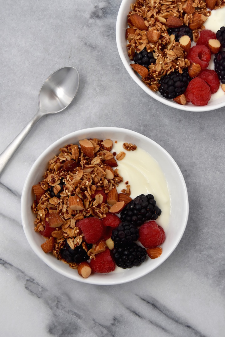 With the warming flavors of cinnamon, vanilla, and maple syrup, this Quinoa Almond Crunch Granola is going to be your new favorite cereal to sprinkle over everything. | uprootkitchen.com