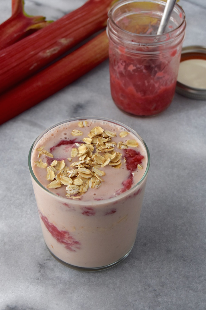 This simple Rhubarb Oat Smoothie is made by blending a rhubarb compote with banana, yogurt, and oats. | uprootkitchen.com