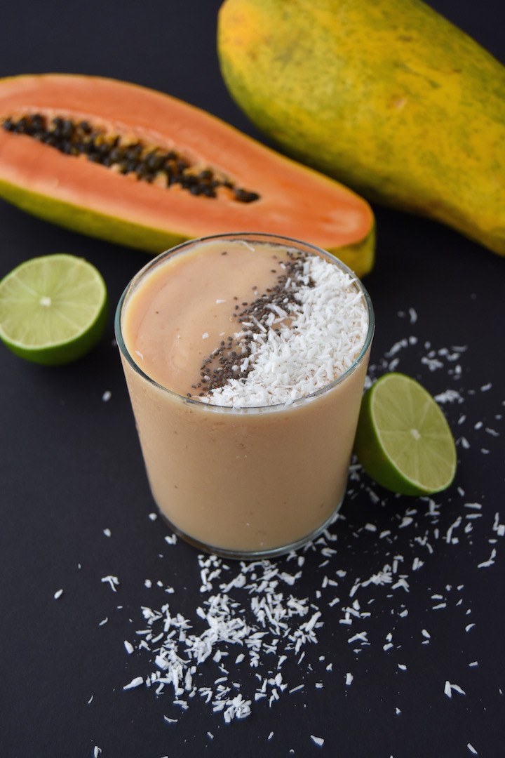This Tropical Papaya Smoothie is a fresh summer sipper that will cool you down with the flavors of papaya, coconut, banana and lime. | uprootkitchen.com